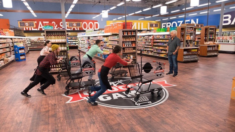 People pushing carts in store