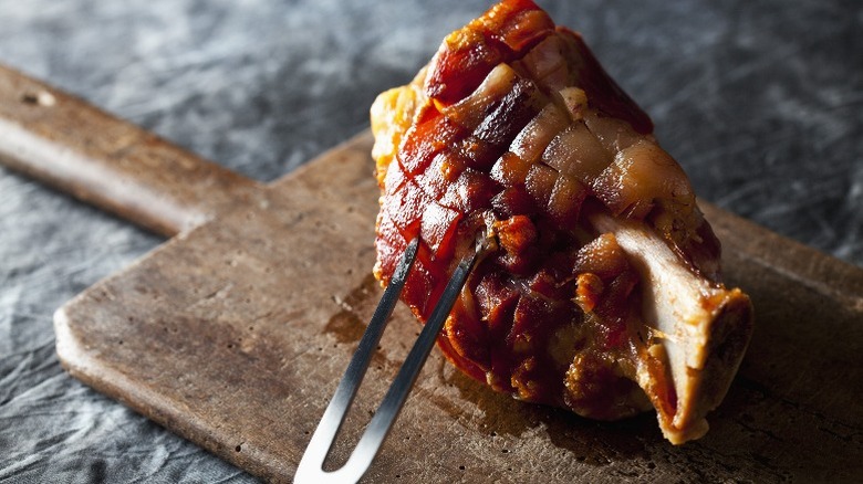 Smoked ham hock on wooden board