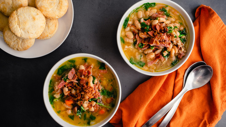 Ham bone soup with white beans and kale with biscuits on the side