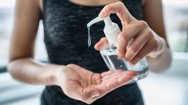 Person using hand sanitizer