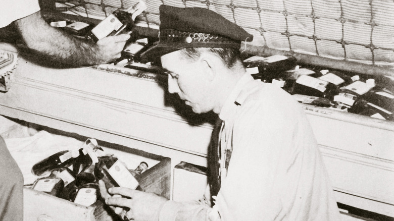 Prohibition agent analyzing contraband alcohol