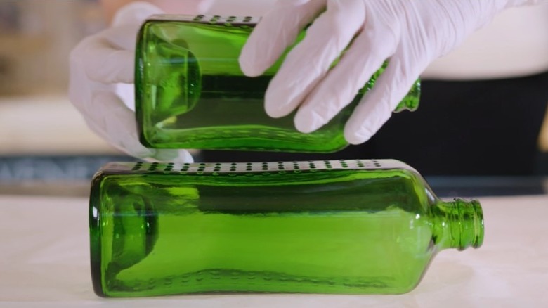 Person stacking WOBO bottles