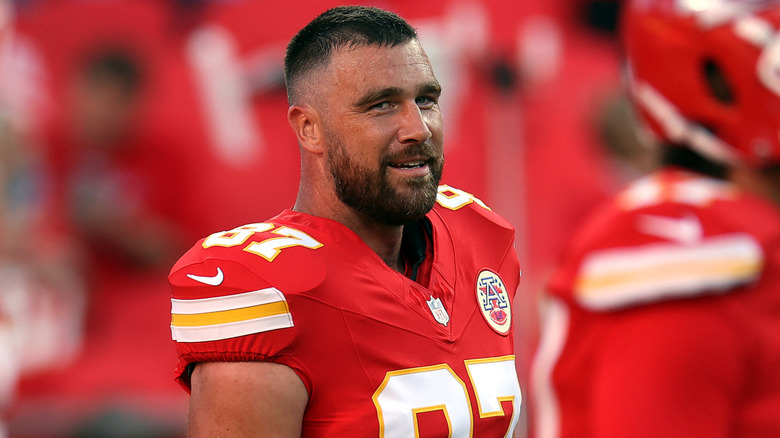 Trave Kelce wearing Chiefs uniform on field