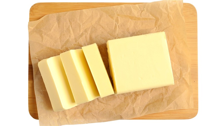 Pats of butter on parchment 