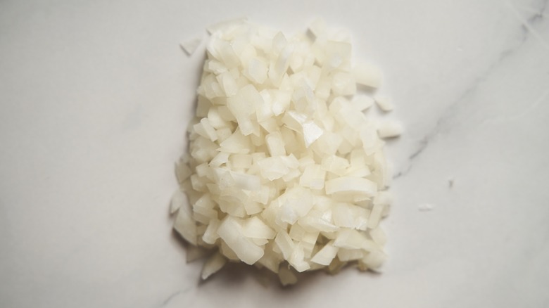 Chopped white onions on white marble