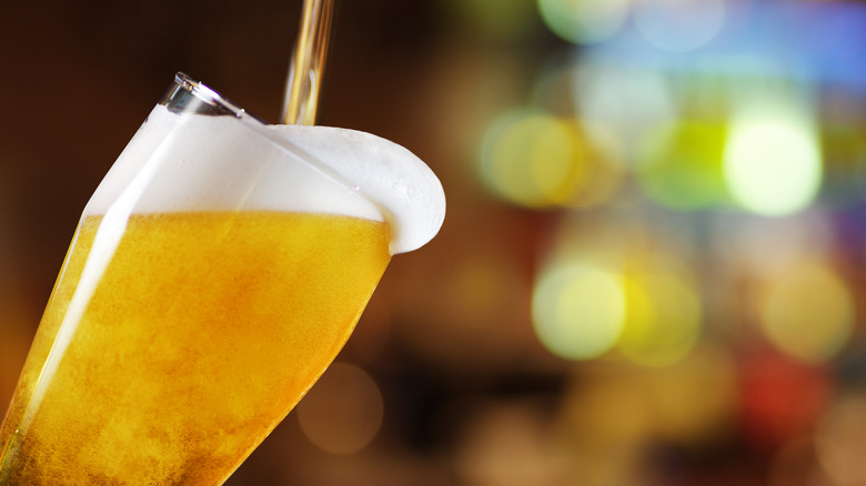 Glass of beer being poured