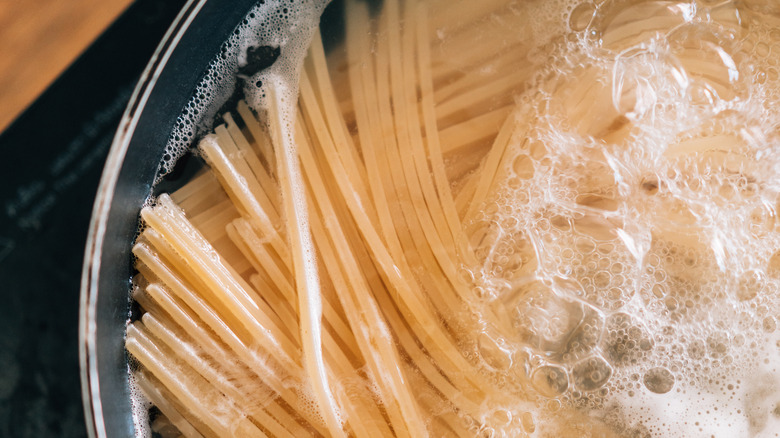spaghetti pasta cooking in boiling water