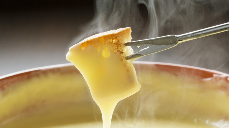 fondue fork with bread piece