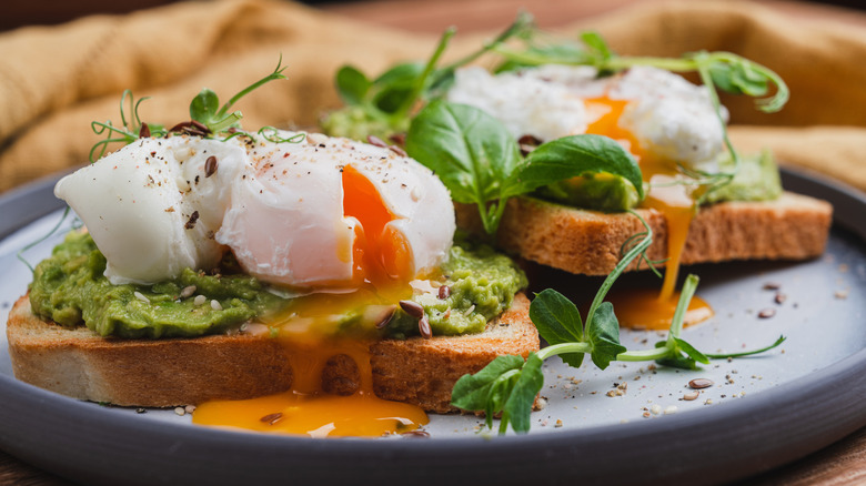 Eggs Benedict on avocado toast