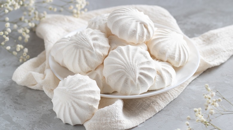 White meringues on white plate