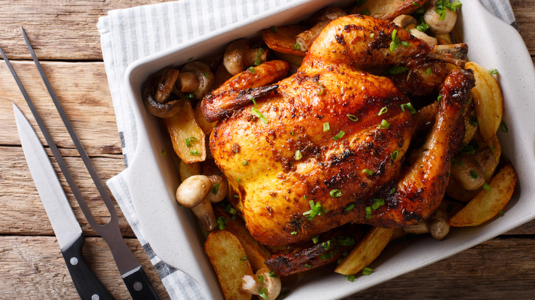 Whole roasted chicken on tray