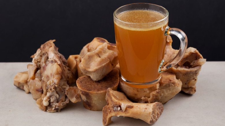 Bones around cup of broth