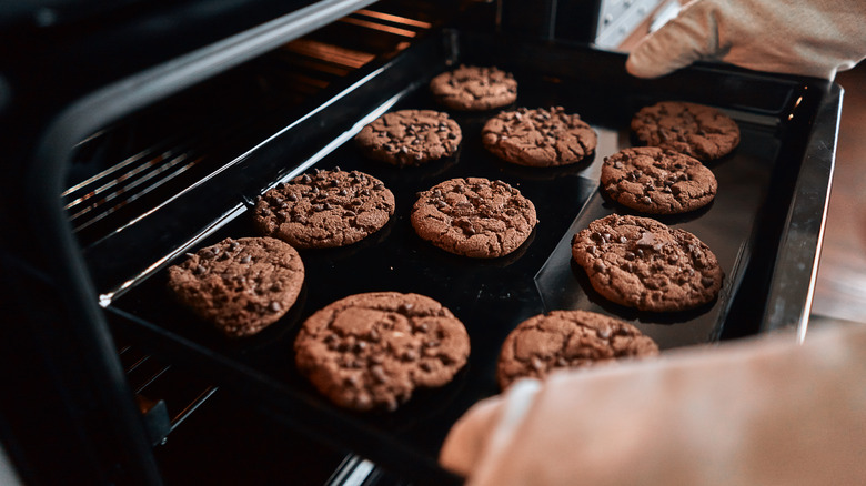 Taking cookies out of oven