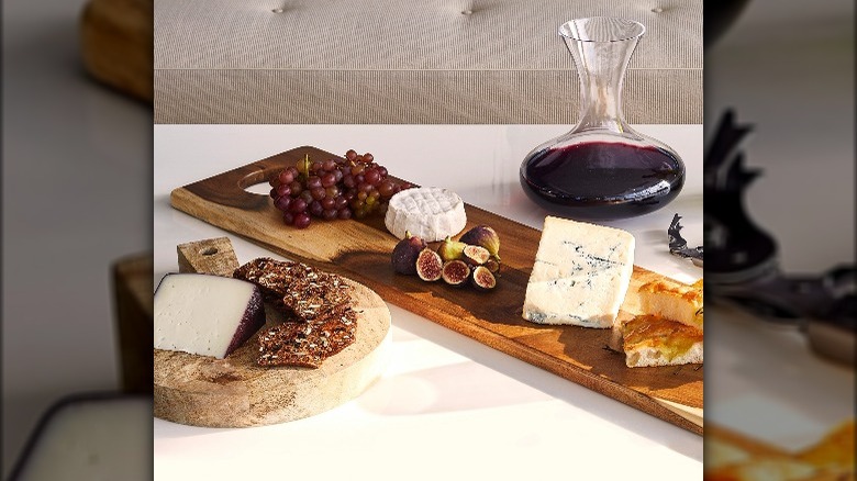 Cheese board with wine carafe