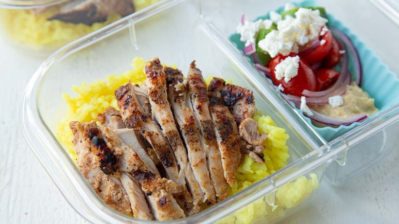 meal-prep chicken shawarma with rice and tomato salad