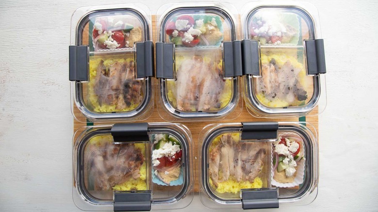 five containers with chicken shawarma meal prep