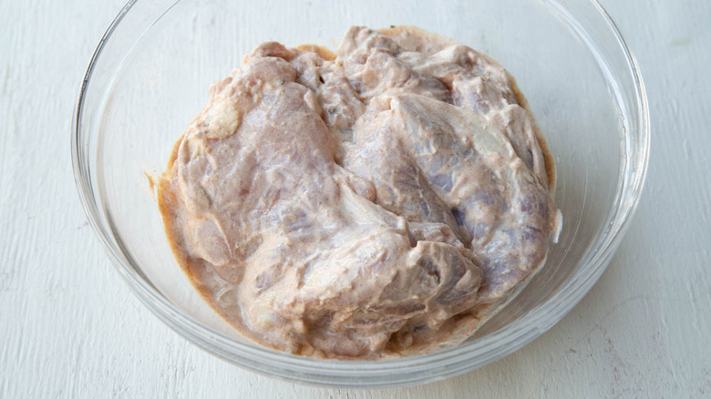 chicken marinating in yogurt mixture