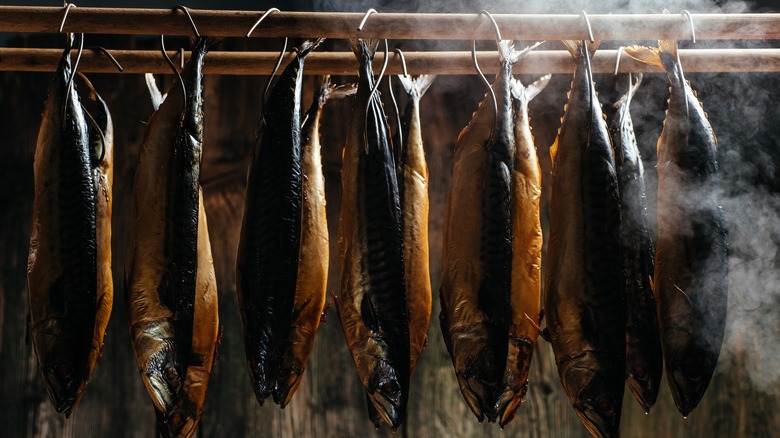 Fish hanging in hot smoker