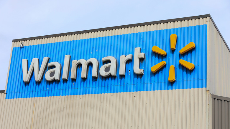 Walmart sign on exterior of building on sunny day