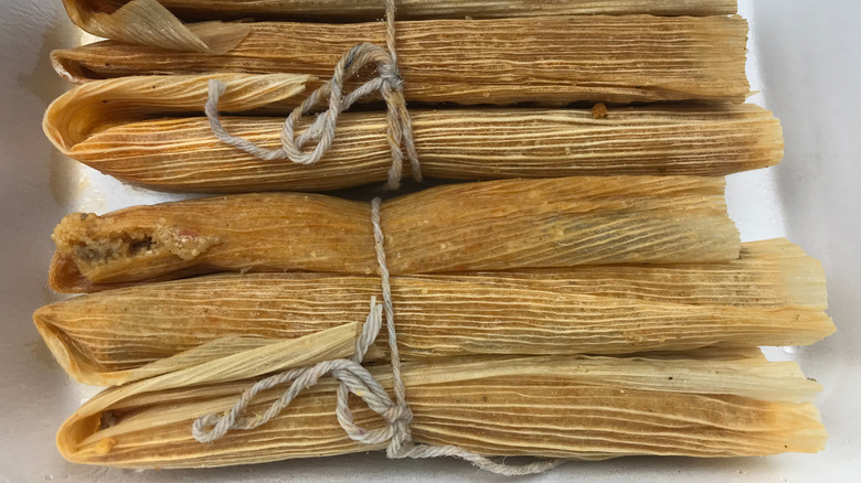 Bundle of Mississippi Delta tamales tied with string