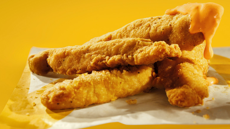 Closeup of McCrispy strips dipped in Creamy Chili sauce