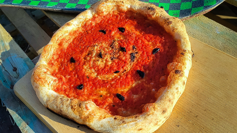 Pizza topped with black garlic 