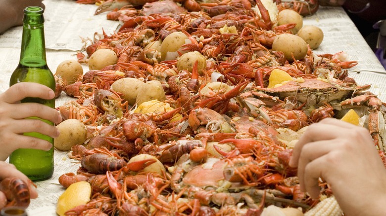 long pile of crawfish on a table