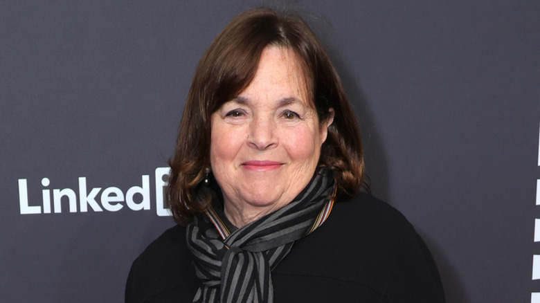 Ina Garten smiles against dark background