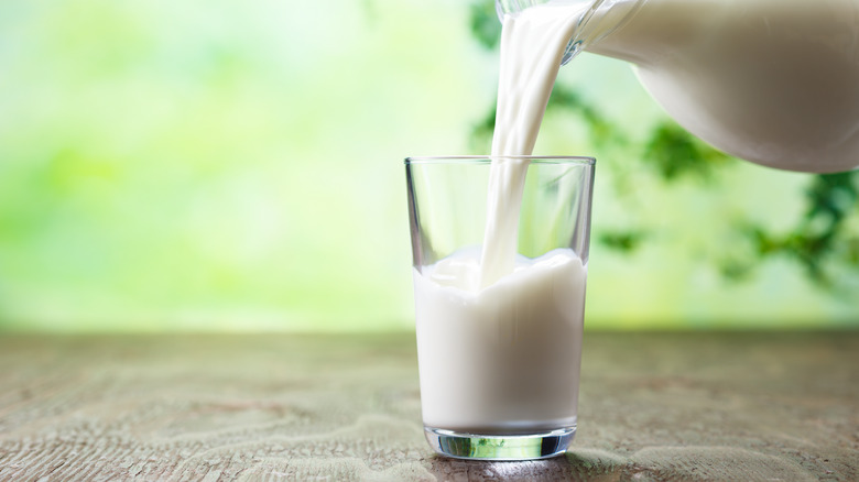 Milk pouring into a glass