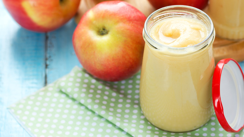 Opened jar of applesauce