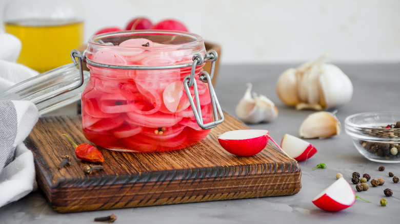 Pickled radishes in jar
