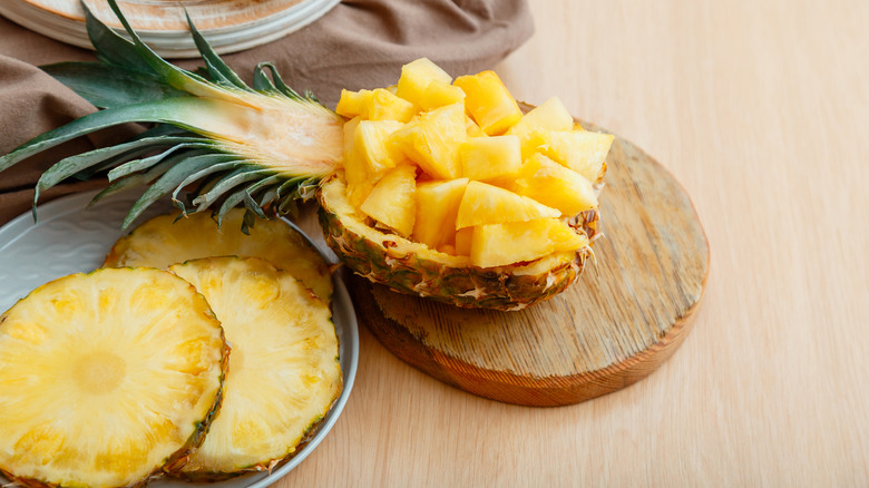 Cut pinapple on a board 