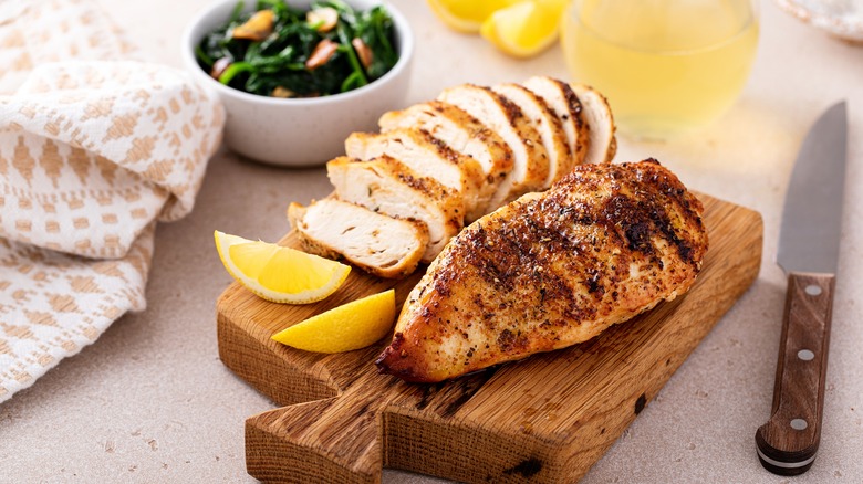 grilled chicken on cutting board
