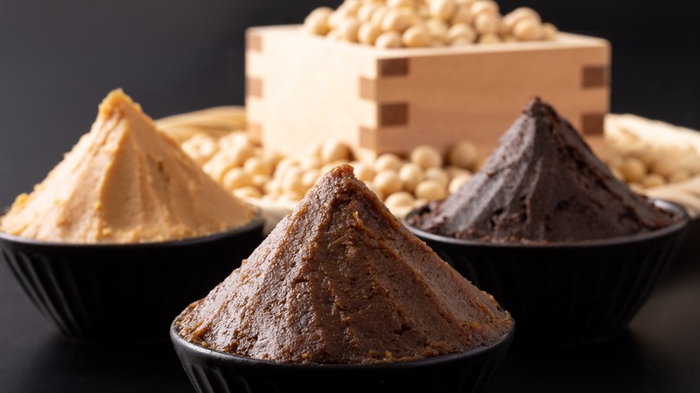 Different types of miso paste in plastic bowls