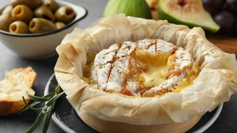 baked brie in a basket on a table