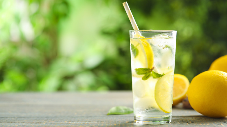 Slices of lemon in glass of ice water