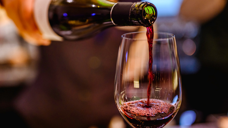 pouring a glass of wine