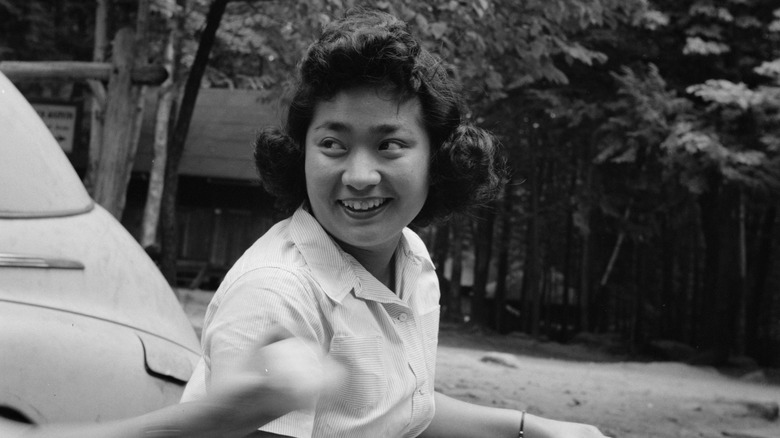 smiling woman walking outside