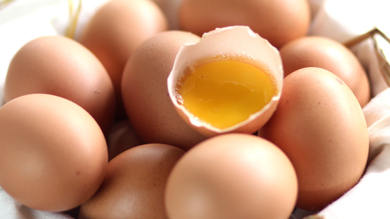Pile of eggs with one cracked
