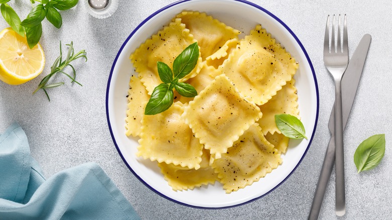Ravioli in dish with basil
