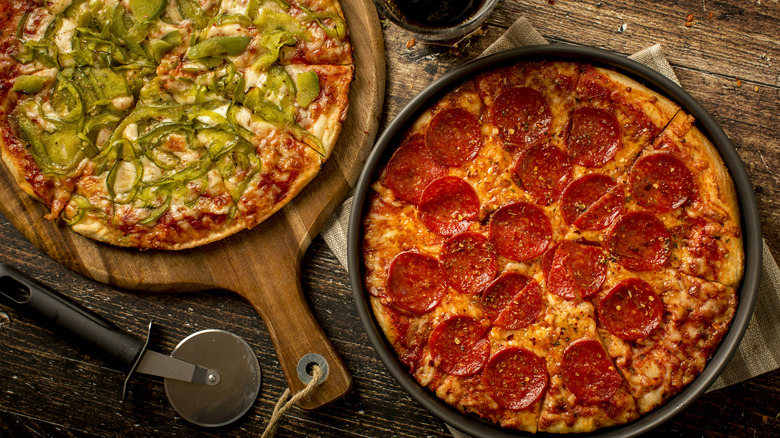 Two pizzas side by side