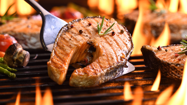 Grilled salmon with fire and vegetables