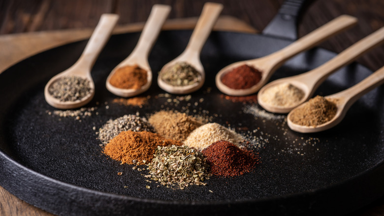Spoonfuls of spices arranged decoratively