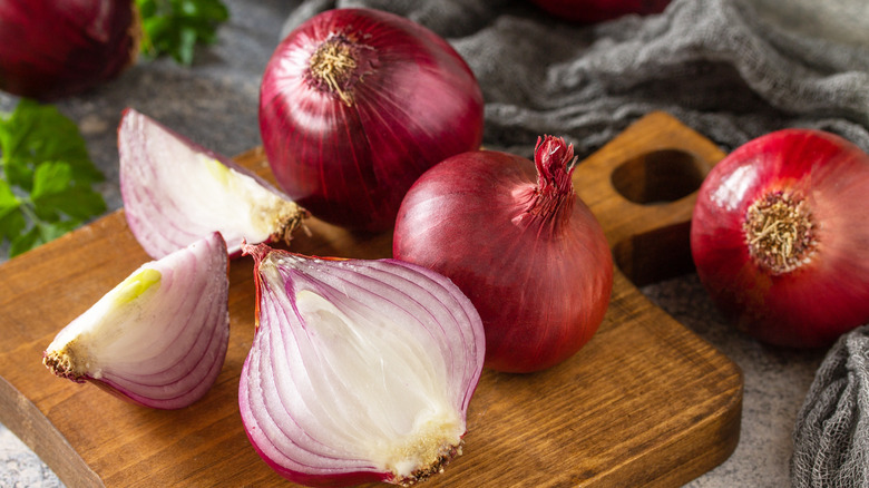 red onions on cutting board