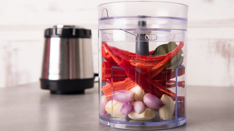 Food processor with vegetables in it