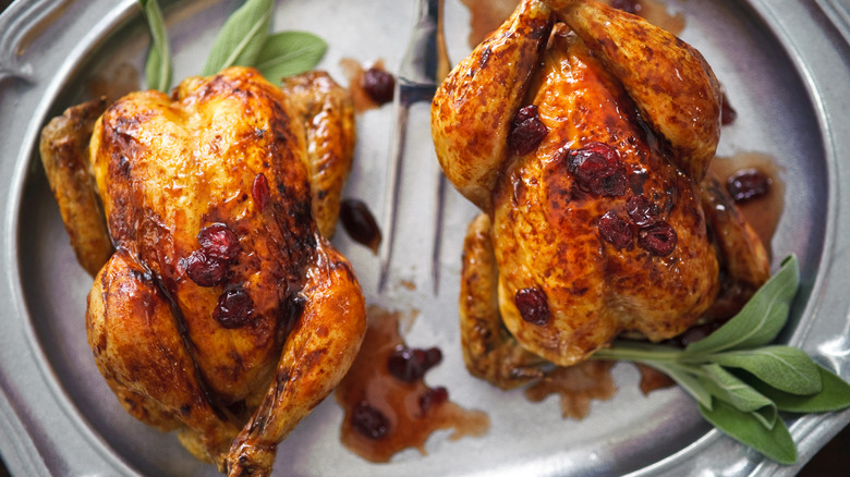 Cornish hens on plate with sage