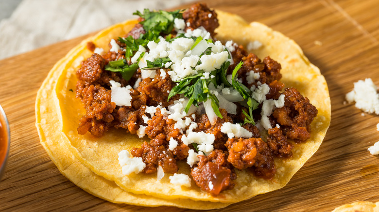 A taco topped with chorizo