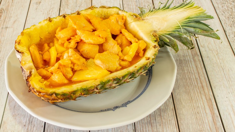 Pineapple and chicken inside pineapple rind