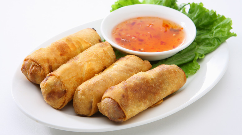 Pile of egg rolls and dip