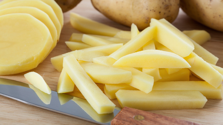 sliced potatoes on cutting board
